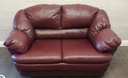 Two seater burgundy leather sofa