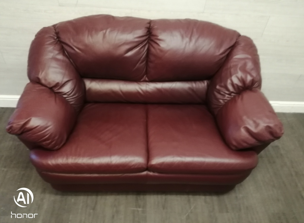 Two seater burgundy leather sofa