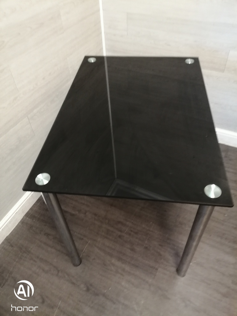 Modern neat black glass dining table
