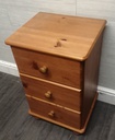 Pine three drawer bedside chest