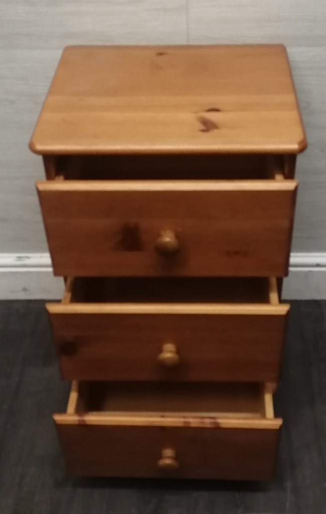 Pine three drawer bedside chest