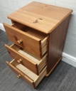 Pine three drawer bedside chest