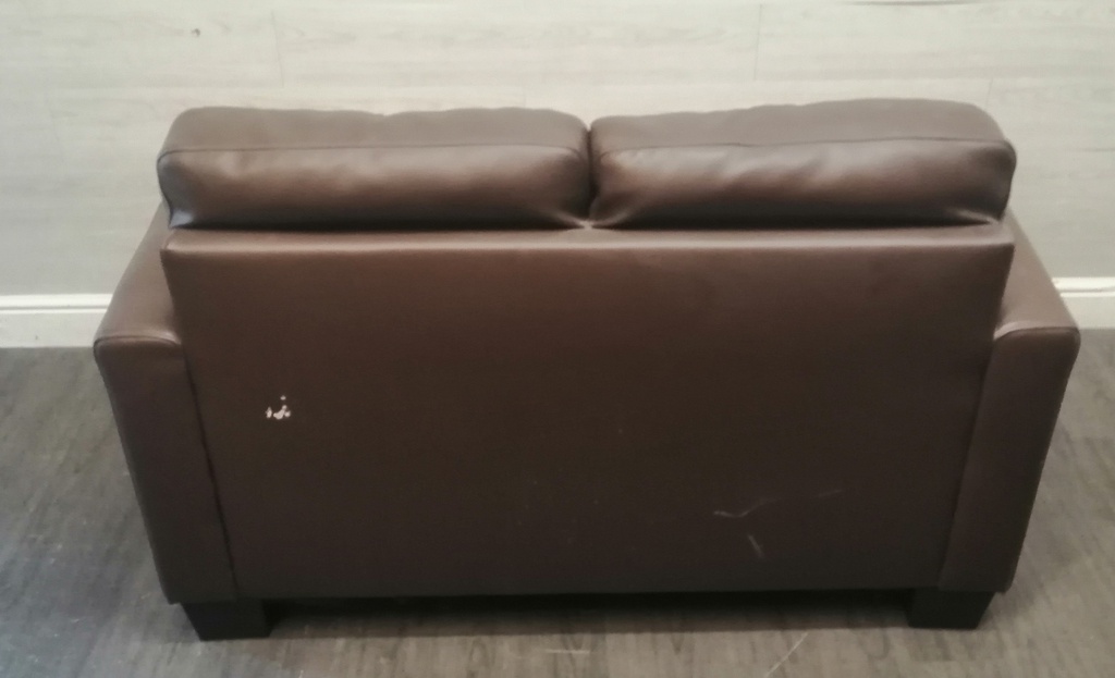 Neat two seater brown leather sofa