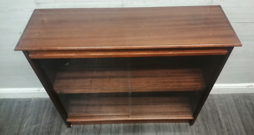 Glazed front sliding door neat bookcase