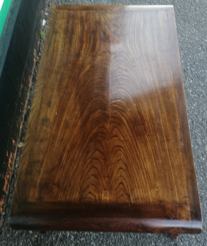 Dark wood scrolled coffee table