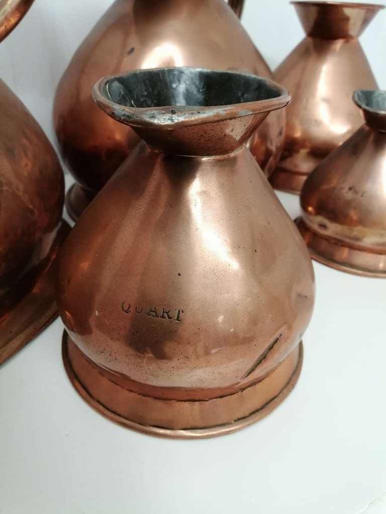 Set of Five Antique Copper Measuring Jugs Set with Lead Stamp
