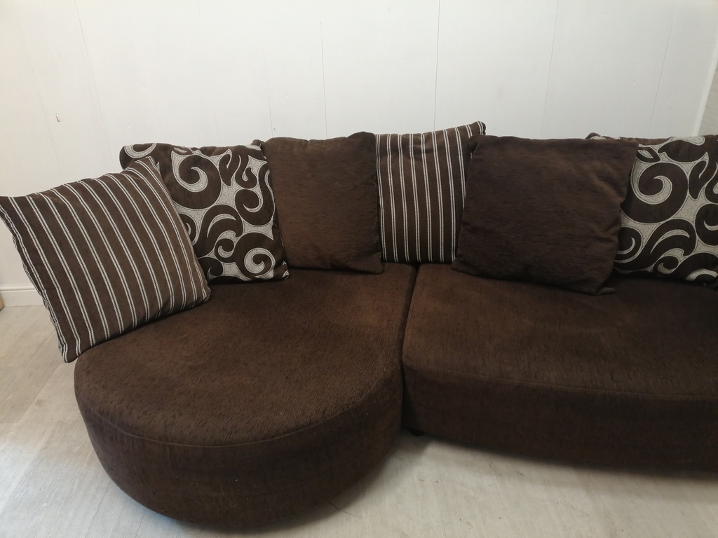 brown toned corner pillow back sofa