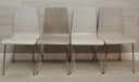 set of four different shades of grey dining chairs