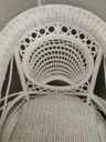 lovely cushioned white wicker armchair