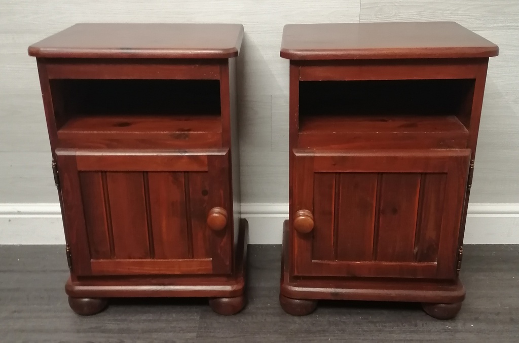 pair of dark pine bedsides cupboards