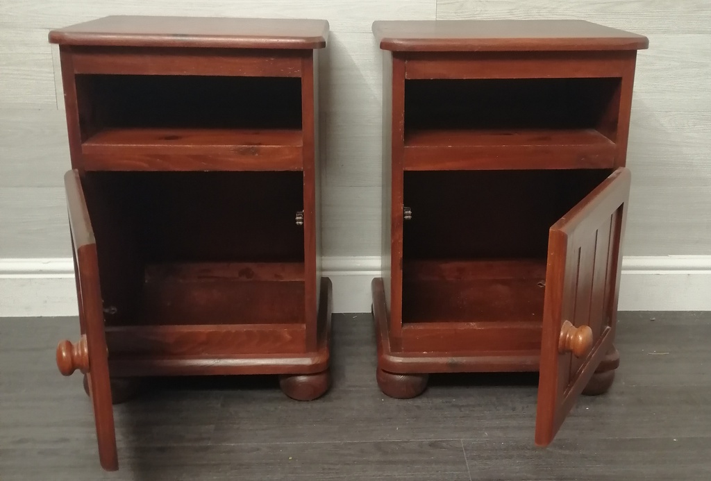 pair of dark pine bedsides cupboards