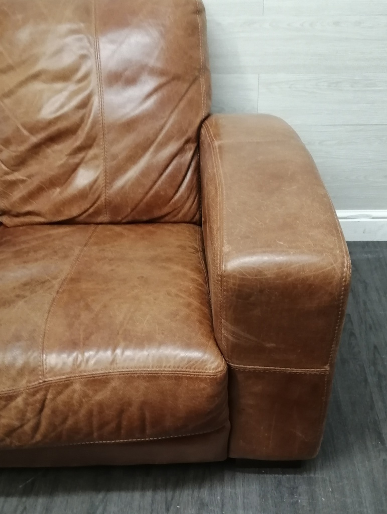 distressed tan leather three seater sofa