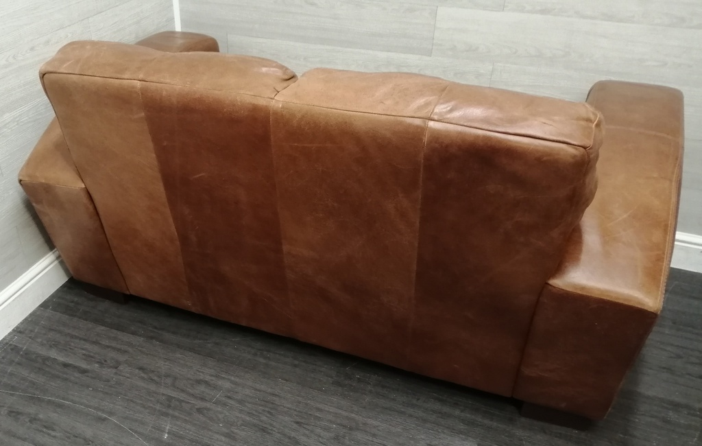 distressed tan leather three seater sofa