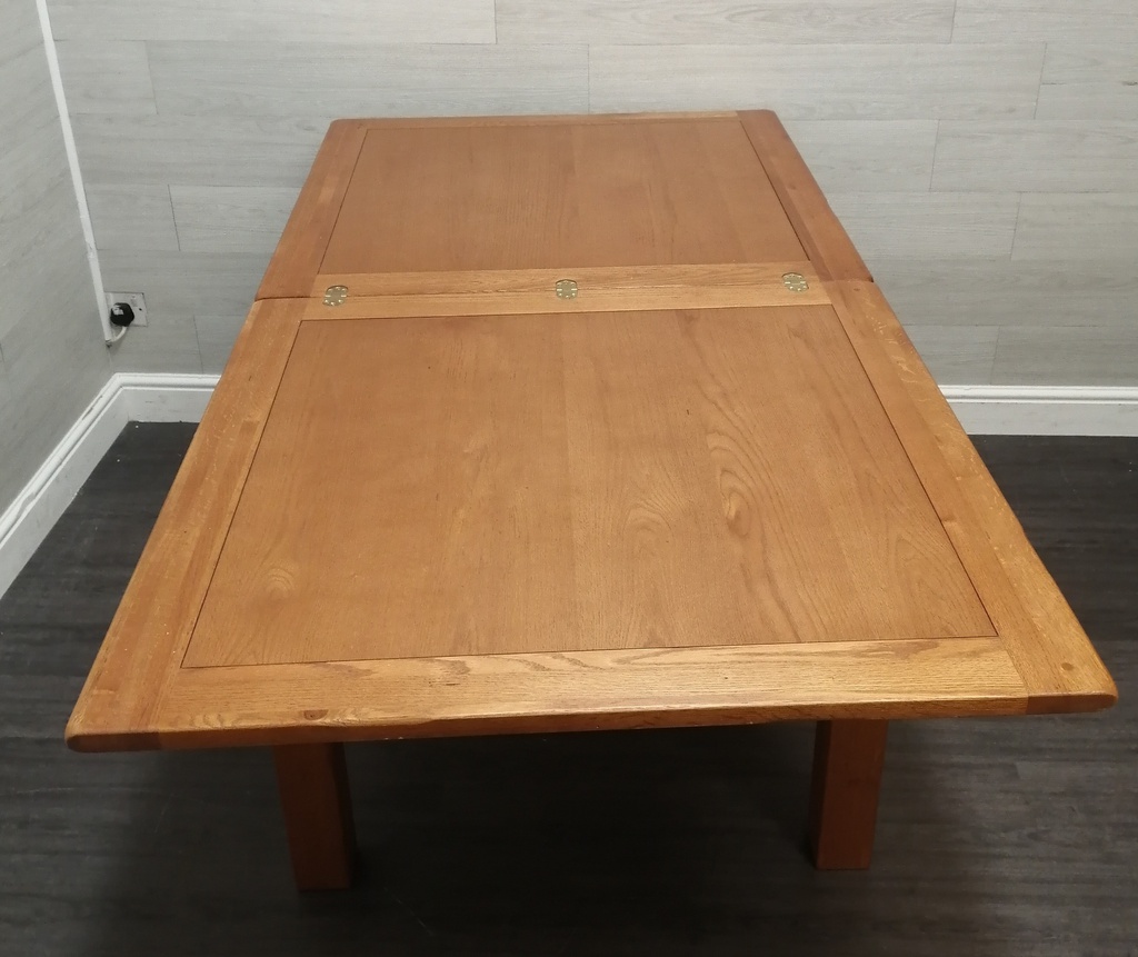 FLIP OVER OAK EXTENDING DINING TABLE