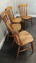 set of four spindle back dining chairs