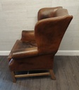 DISTRESSED TAN  LEATHER CHESTERFIELD STYLE ARMCHAIR