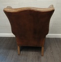 DISTRESSED TAN  LEATHER CHESTERFIELD STYLE ARMCHAIR