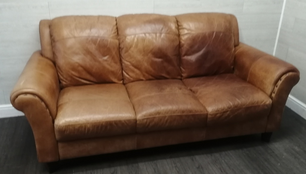 distressed tan leather three seater sofa