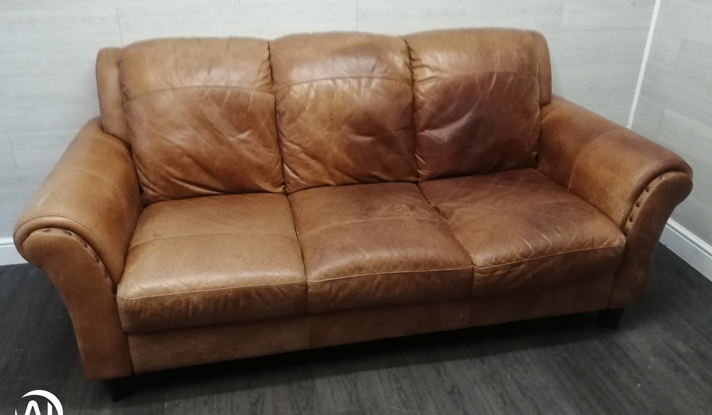 distressed tan leather three seater sofa