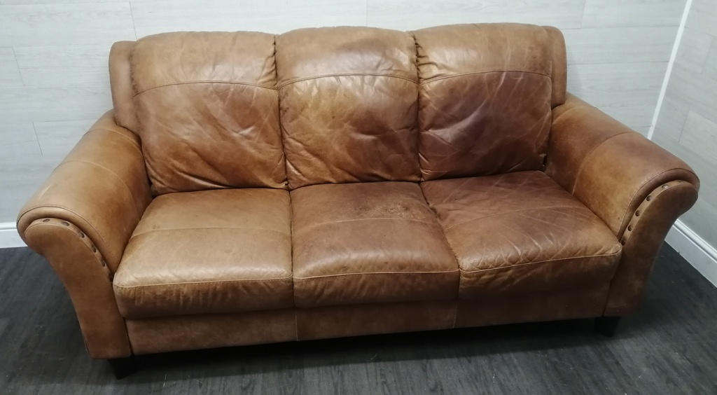 distressed tan leather three seater sofa