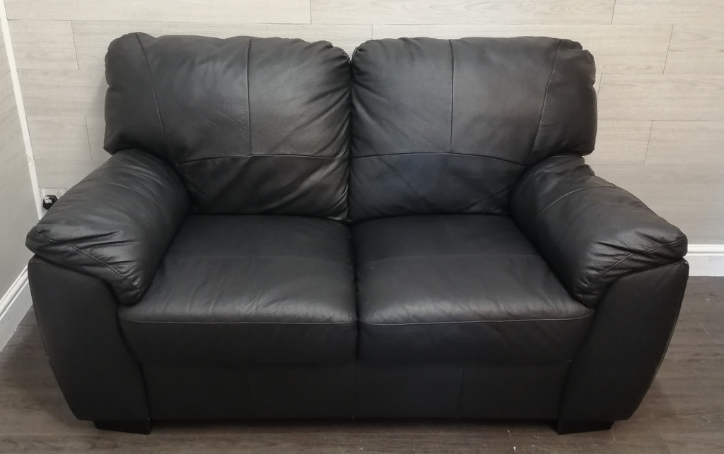 black faux leather two seater sofa