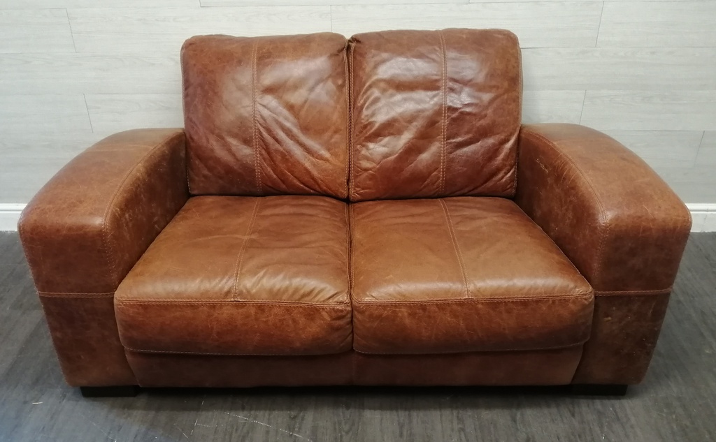 distressed tan leather two seater sofa