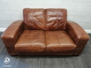 distressed tan leather two seater sofa