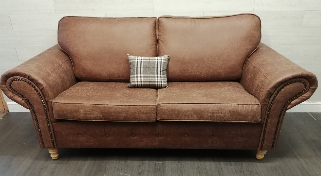 lovely brown toned three seater sofa