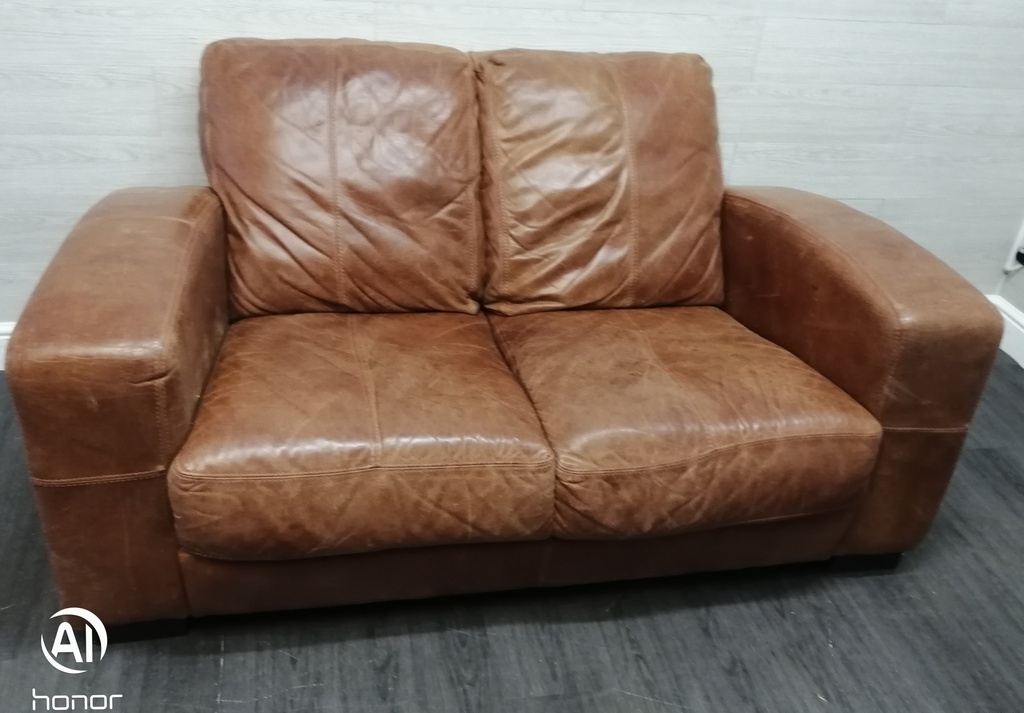 distressed tan leather three seater sofa