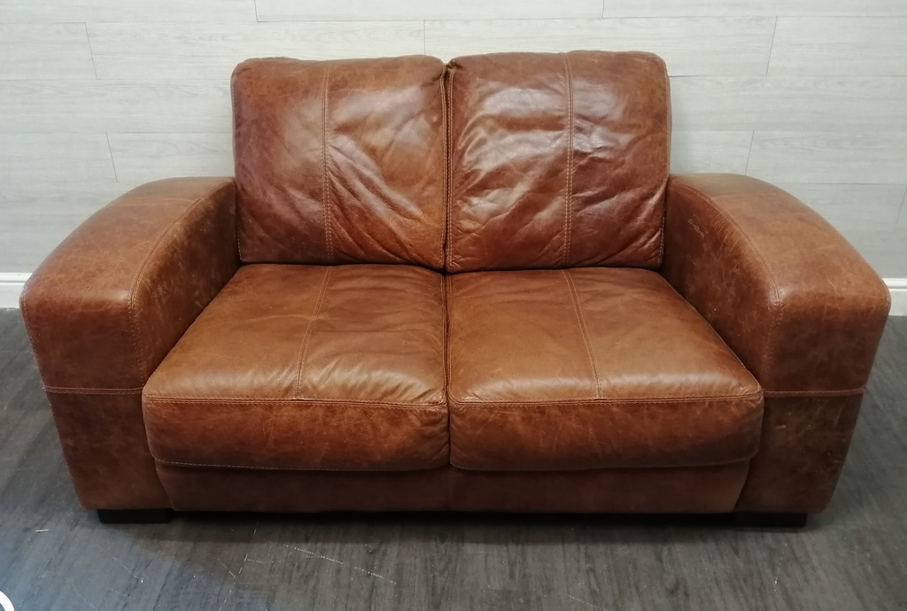 distressed tan leather two seater sofa