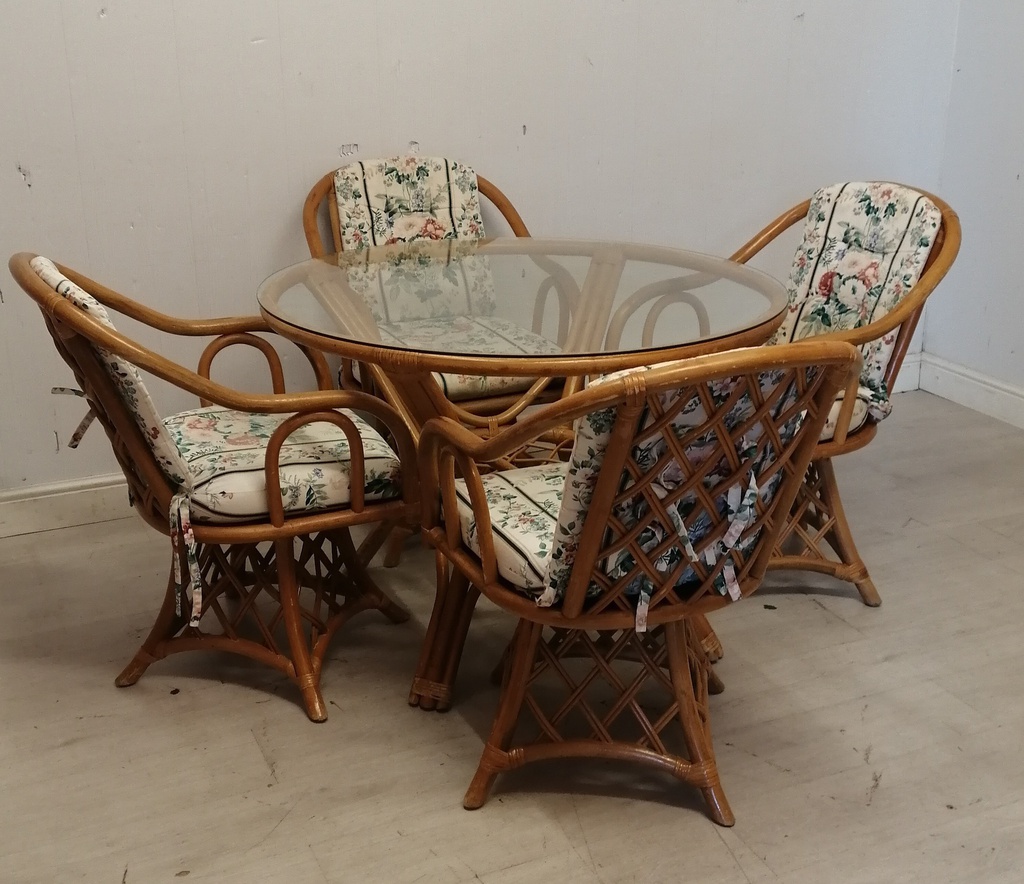 Cane conservatory dining table best sale and chairs